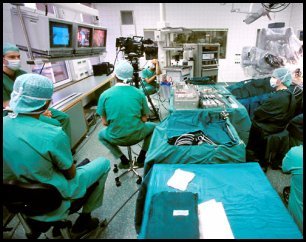 Hospitals build - surgeons use computers to perform operations.